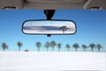 Snow Landscape reflected in car rear mirror Royalty Free Stock Photo