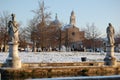 Snow in the lawn and the church of Santa Giustina in Padua.