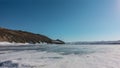 Snow lies on the surface of the frozen lake. Royalty Free Stock Photo