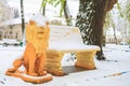 Snow on the lion sculpture in the park. Winter background, selective focus