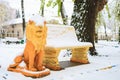 Snow on the lion sculpture in the park. Winter background, selective focus