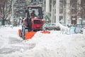 Snow machine cleans the snow in the city.