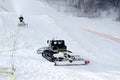Snow machines on the snow-covered road ski resort. Royalty Free Stock Photo