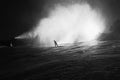 Snow making on slope. Skier near a snow cannon making fresh powder snow. Mountain ski resort in winter calm.