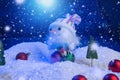 Snow Man with Christmas balls on snow over fir-tree, night sky and moon. Shallow depth of field. Christmas background Royalty Free Stock Photo