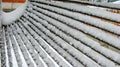 Snow on a metal fence made of rods Royalty Free Stock Photo