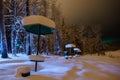 In snow a metallic table for the picnic in forest park zone in winter. Royalty Free Stock Photo
