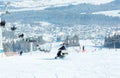 Snow mobile at Tatra mountains with white snow and blue sky