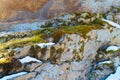 The snow and moss on the ledges of granite rocks Royalty Free Stock Photo