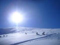 Snow mountain and big bright sun