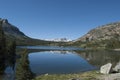 Snow Mountain, blue water lake and blue sky. Deflection of mountains in the lake water Royalty Free Stock Photo