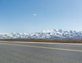 Snow mountain with empty asphalt road Royalty Free Stock Photo