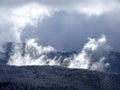 Snow mountain forest  with burning clouds above Royalty Free Stock Photo