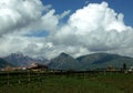 Snow mountain horizon under blue and cloudy sky