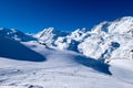 Snow mountain, ski track, footprints on snow with tiny signpost Royalty Free Stock Photo