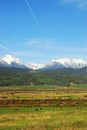 Snow mountains and farms Royalty Free Stock Photo