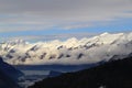 Snow mountains. low clouds ang the lake under clouds