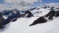 Ski area in summer, snow slopes and mountain peaks Royalty Free Stock Photo