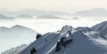 Snow Mountains Panorama in low lying inversion valley fog. Silhouettes of foggy Mountains. Scenic snowy winter landscape Royalty Free Stock Photo