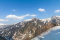 The snow mountains view of Tateyama Kurobe alpine with blue sky background