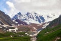 The snow mountains and yurts in the high mountain meadow of Nalati grassland Royalty Free Stock Photo