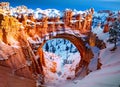 snow on natural bridge arch in bryce canyon national park. Generative AI Royalty Free Stock Photo