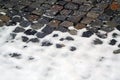 Snow on old stone pavement Royalty Free Stock Photo