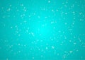 Snow particles on bright turquoise background
