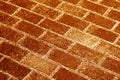Snow on pavement texture in orange tone. Royalty Free Stock Photo