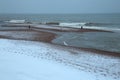 Snow on the pebble beach