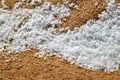 Snow pellets, graupel or soft hail on sand. Form of precipitation Royalty Free Stock Photo