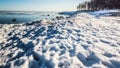 Snow pile, hill. Large snow drift  on a blue sky background,  outdoor view of ice blocks at frozen finland lake in winter Royalty Free Stock Photo