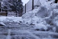 A snow pile near fence. Trying shoveling snow from driveway. Twenty centimetres snow coverlet must be cleaned Royalty Free Stock Photo