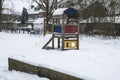 Snow on the playground equipment of a schoolyard Royalty Free Stock Photo