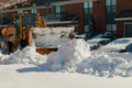 Snow plough truck clearing road after winter snowstorm for vehicle access Royalty Free Stock Photo