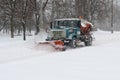 Snow plow cleaning snow