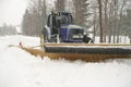 Snow plow cleaning street