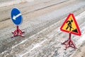 Snow-plow remove snow from the city street.Warning road sign.Winter service vehicle snow blower work.Cleaning snowy