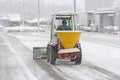 Snow plow removing snow