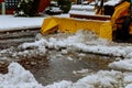 Snow plow truck clearing road after winter snowstorm blizzard vehicle access Royalty Free Stock Photo