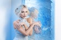 Snow queen near frozen mirror Royalty Free Stock Photo