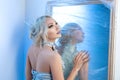 Snow queen near frozen mirror Royalty Free Stock Photo