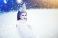 Snow Queen in Winter Fantasy Landscape - Beautiful princess with ice crown in winter land Royalty Free Stock Photo