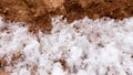 Snow on red clay in nature Royalty Free Stock Photo