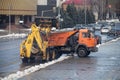 Snow removal in the city with the help of special equipment of a road maintenance company.