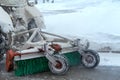 Snow removal equipment attached to tractor. Rear view, close-up
