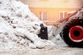 Snow removal excavator tractor cleaning on winter road covered with snow Royalty Free Stock Photo