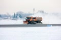 Snow-removal machine cleans the main taxiway at the airport