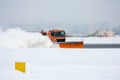 Snow-removal machine cleans the runway at the airport