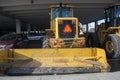 Snow Removal Plow Tractor in CIty Parkade
